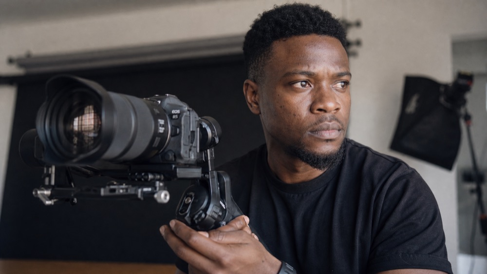 Filmmaker holding a camera gimbal during the AI Video and Movie Creation workshop