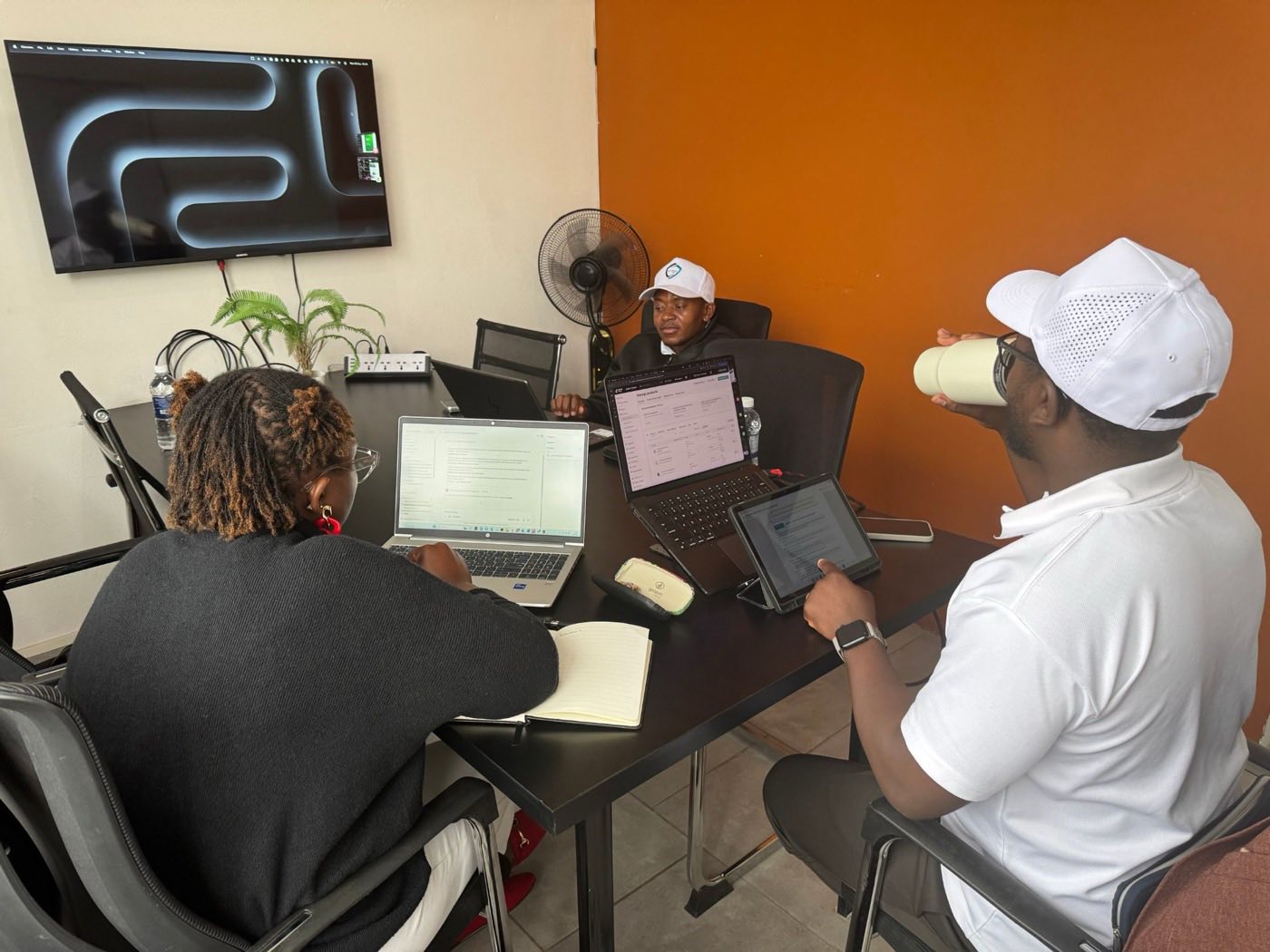 Skaitbridge Lab facilitator running a live AI training session with a corporate team in Harare, Zimbabwe